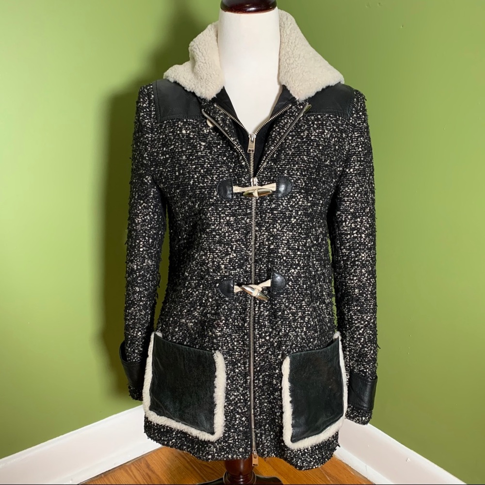 Wool blend jacket with removable hood.